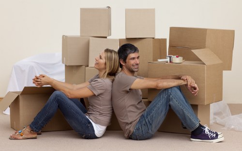 Professional packing team preparing boxed household items for a Maryland move
