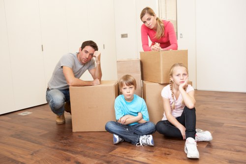 Local packers organizing boxes in a Maryland home before moving day