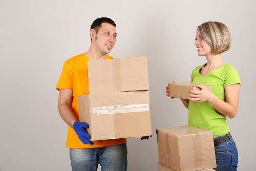 Residential packing service organizing boxes in a Maryland home